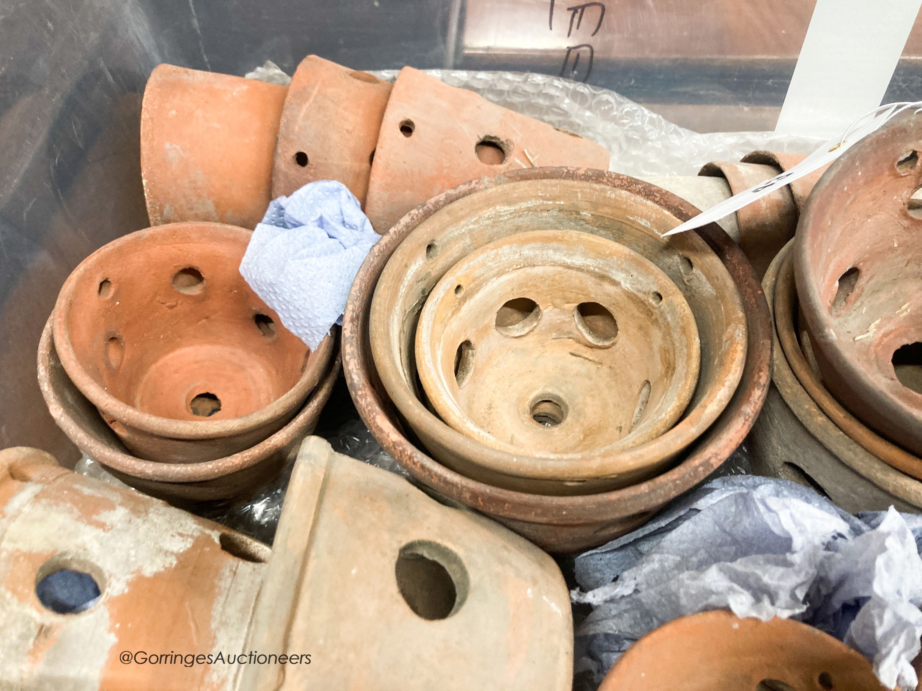 Approximately twenty six terracotta orchid pots, some stamped Sankey's Ltd, in assorted sizes, largest 12cm